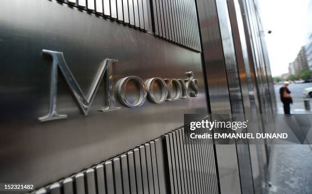Sign for Moody's rating agency stands in front of the company headquarters in New York, September 18, 2012. AFP PHOTO/Emmanuel Dunand