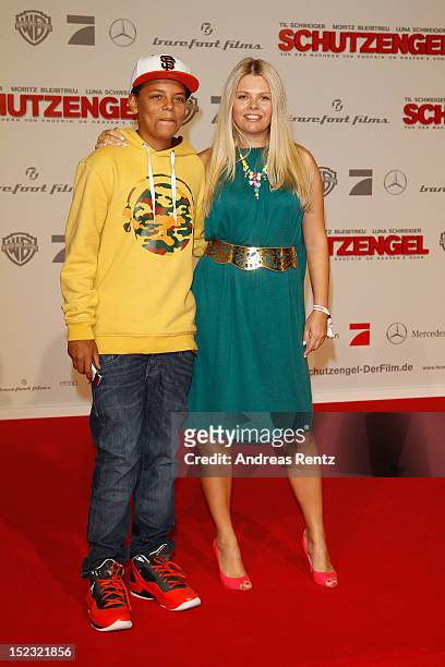 Anne-Sophie Briest and her son Jahmar attend the 'Schutzengel' Premiere at CineStar on September 18, 2012 in Berlin, Germany.