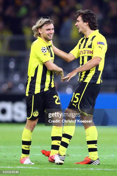 Marcel Schmelzer and Mats Hummels of Dortmund celebrate the 1-0 vicztory after the UEFA Champions League group D match between Borussia Dortmund and...