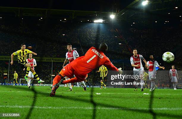 Robert Lewandowski of Dortmund scores his teams winning goal during the UEFA Champions League group D match between Borussia Dortmund and Ajax...