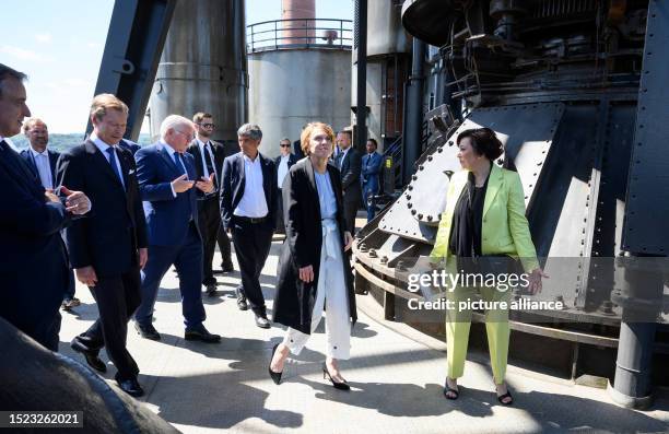 July 2023, Luxembourg, Luxemburg: Federal President Frank-Walter Steinmeier and his wife Elke Büdenbender look at the blast furnaces of Belval and...