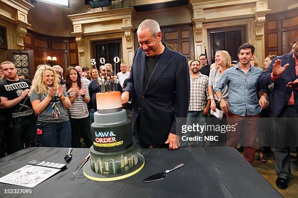 300th Episode Celebration -- Pictured: Executive Producer Dick Wolf cuts into a cake to celebrate the 300th episode of "Law & Order: Special Victims...