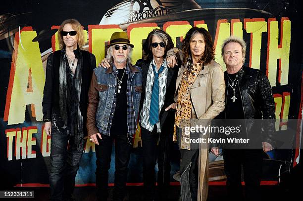 Musicians Tom Hamilton, Brad Whitford, Joe Perry, Steven Tyler and Joey Kramer of Aerosmith pose at the press junket to announce their new album...