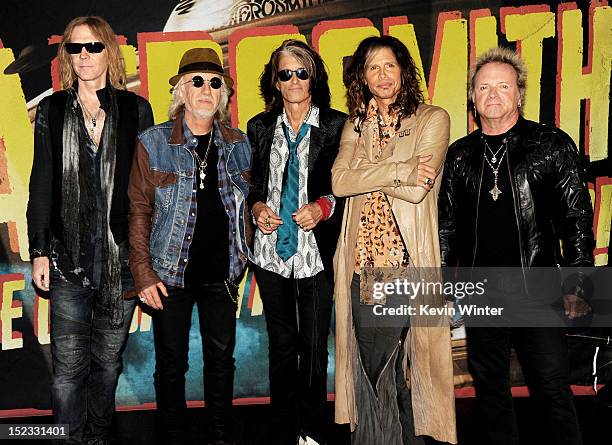 Musicians Tom Hamilton, Brad Whitford, Joe Perry, Steven Tyler and Joey Kramer of Aerosmith pose at the press junket to announce their new album...