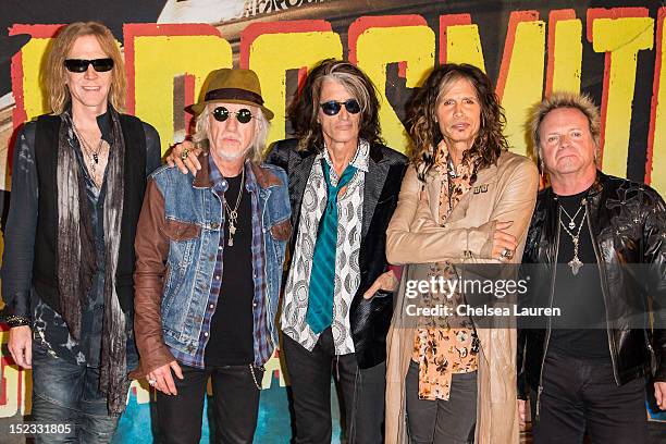 Bassist Tom Hamilton, guitarist Brad Whitford, guitarist Joe Perry, vocalist Steven Tyler and drummer Joey Kramer of Aerosmith pose at House of Blues...