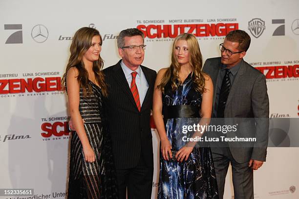 Lilli Schweiger, German Defense Minister Thomas de Maiziere, Luna Schweiger and Til Schweiger attends the premiere of 'Schutzengel' at Sony Center on...