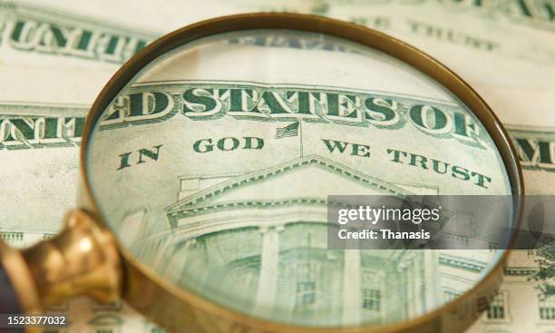 close-up on a twenty-dollar bill and a magnifying glass - us coin stock pictures, royalty-free photos & images