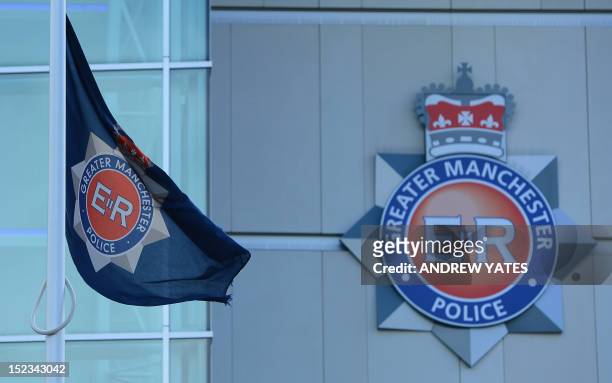 Flag flies at half mast at the headquaters of Greater Manchester Police in Manchester, northwest England, to pay respect to two female police...