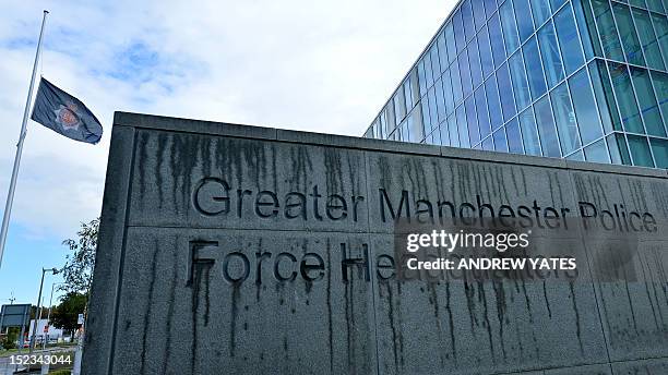 Flag flies at half mast at the headquaters of Greater Manchester Police in Manchester, northwest England, to pay respect to two female police...