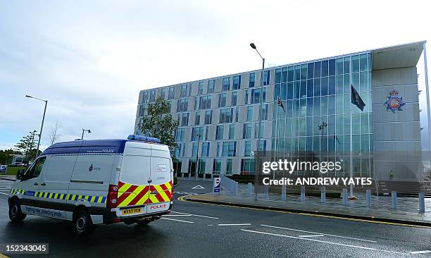 Flag flies at half mast at the headquaters of Greater Manchester Police in Manchester, northwest England, to pay respect to two female police...