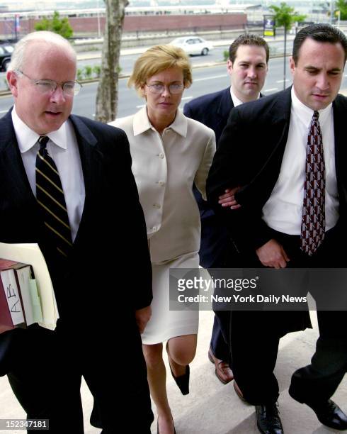 Elena Kiejliches is on trial for murdering her husband so she could run away with another man, shown here with her attorneys John Murphy, Jr., Jason...