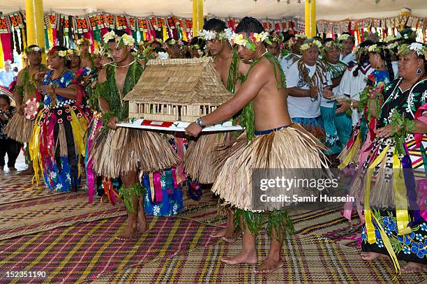 Catherine, Duchess of Cambridge and Prince William, Duke of Cambridge receive gifts from locals at a farewell ceremony during the Royal couple's...