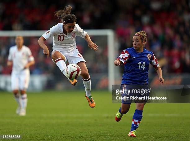 Fara Williams of England controls the ball infront of Andrea Martic of Croatia during the UEFA Women's EURO 2013 Group 6 Qualifier between England...