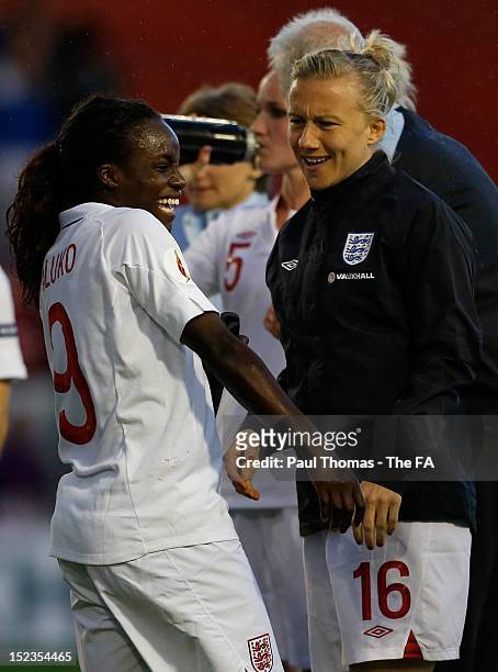 Eniola Aluko and Laura Bassett of England celebrate at full time of the UEFA European Women's 2013 Championship Qualifier between England and Croatia...