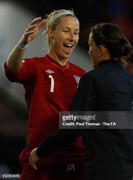 Karen Bardsley and Casey Stoney of England celebrate at full time of the UEFA European Women's 2013 Championship Qualifier between England and...