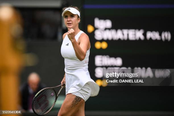 Ukraine's Elina Svitolina celebrates winning a point against Poland's Iga Swiatek during their women's singles quarter-finals tennis match on the...