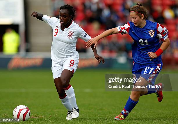 Eniola Aluko of England in action with Gabrijela Gaiser of Croatia during the UEFA European Women's 2013 Championship Qualifier between England and...