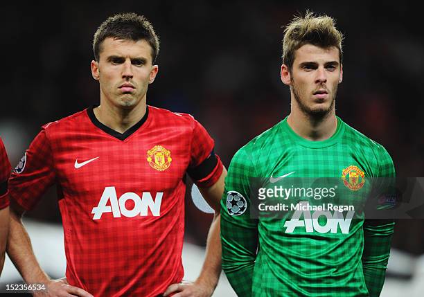Michael Carrick and David De Gea of Manchester United wear black armbands as a tribute to the two policewomen who died on Tuesday in the Greater...