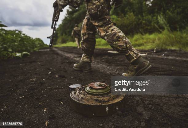 Ukrainian army's 35th Marine Brigade members conduct mine clearance work at a field in Donetsk, Ukraine on July 11, 2023.