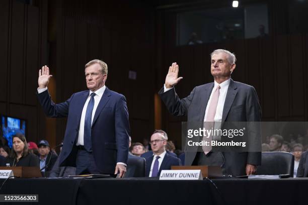 Ron Price, chief operating officer of PGA Tour, left, and Jimmy Dunne, board member with PGA Tour, are sworn in during a Senate Homeland Security and...