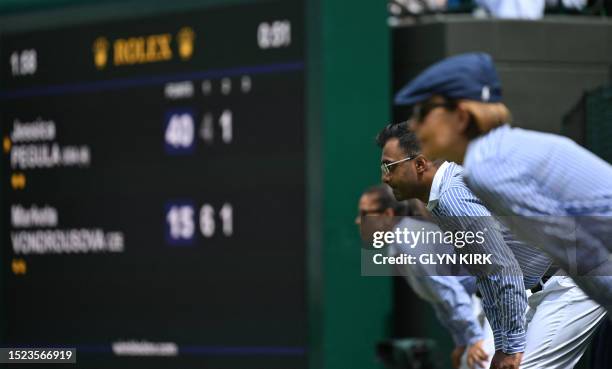 Judges watch the game between US player Jessica Pegula and Czech Republic's Marketa Vondrousova during their women's singles quarter-finals tennis...