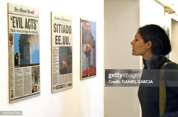 Woman looks at the front pages of Brazilian newspapers in an exposition organizaed by the Spanish agency EFE at the Cultural Center Recoleta in...