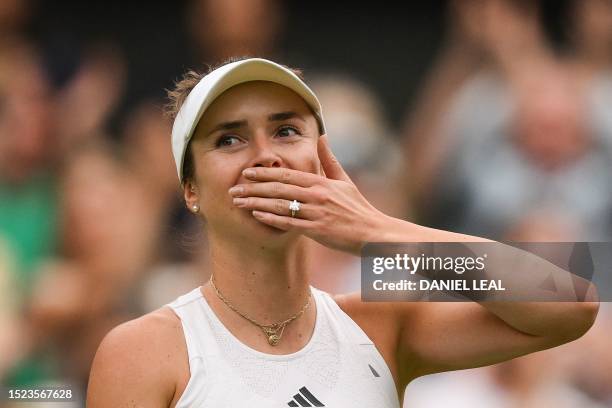 Ukraine's Elina Svitolina blows a kiss as she celebrates winning against Poland's Iga Swiatek during their women's singles quarter-finals tennis...