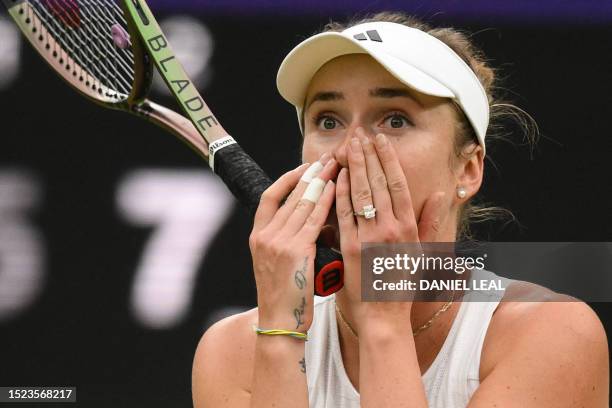 Ukraine's Elina Svitolina celebrates winning against Poland's Iga Swiatek during their women's singles quarter-finals tennis match on the ninth day...