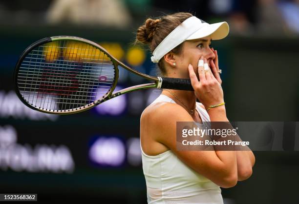Elina Svitolina of Ukraine reacts to defeating Iga Swiatek of Poland in the quarter-final during Day Nine of The Championships Wimbledon 2023 at All...