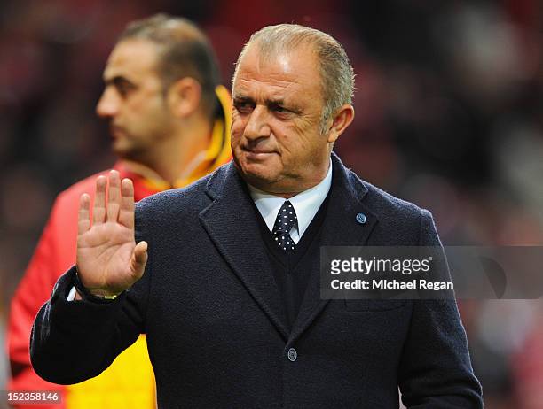 Fatih Terim manager of Galatasaray waves prior to the UEFA Champions League Group H match between Manchester United and Galatasaray at Old Trafford...