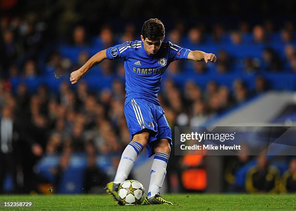 Oscar of Chelsea scores their first goal during the UEFA Champions League Group E match between Chelsea and Juventus at Stamford Bridge on September...