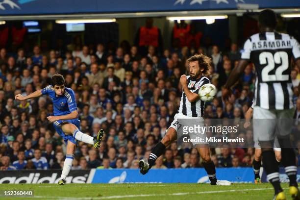 Oscar of Chelsea scores their second goal during the UEFA Champions League Group E match between Chelsea and Juventus at Stamford Bridge on September...