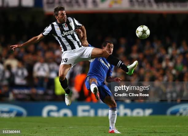 Andrea Barzagli of Juventus and Eden Hazard of Chelsea compete for the ball during the UEFA Champions League Group E match between Chelsea and...