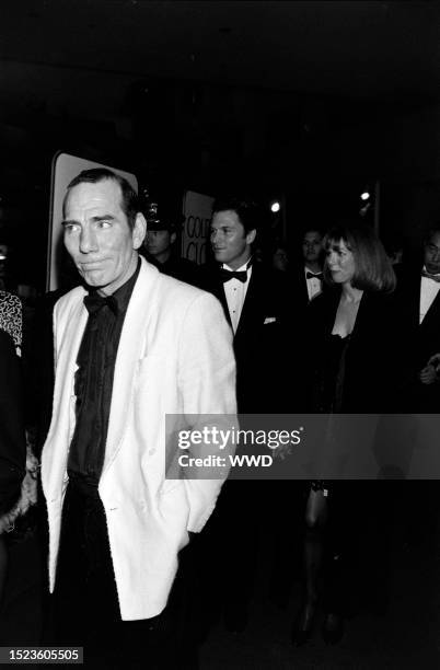 Pete Postlethwaite, Tim Daly, and Amy Van Nostrand attend the 51st Annual Golden Globe Awards on January 22 at the Beverly Hilton Hotel in Beverly...