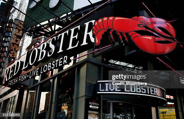 Red Lobster signage is displayed outside of a restaurant location in New York, U.S., on Wednesday, Sept. 19, 2012. Darden Restaurants Inc., operators...