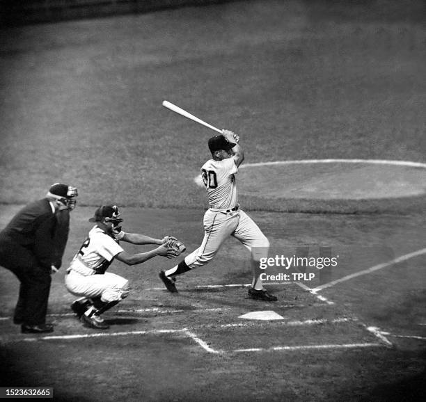 Orlando Cepeda of the San Francisco Giants swings at the pitch during an exhibition game against the New York Yankees at Yankee Stadium in the Bronx,...