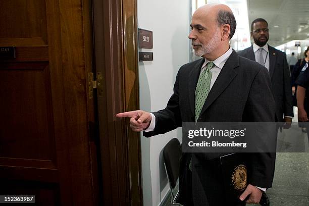 Ben S. Bernanke, chairman of the U.S. Federal Reserve, arrives to a Senate Finance Committee meeting on Capitol Hill in Washington, D.C., U.S., on...