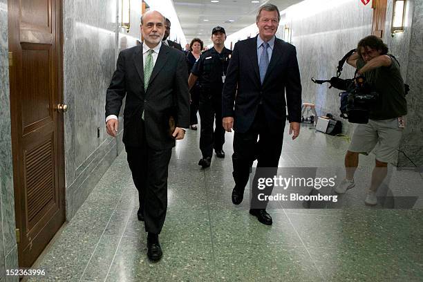 Ben S. Bernanke, chairman of the U.S. Federal Reserve, left, and Senator Max Baucus, a Democrat from Montana and chairman of the Senate Finance...