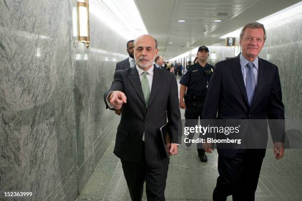 Ben S. Bernanke, chairman of the U.S. Federal Reserve, left, and Senator Max Baucus, a Democrat from Montana and chairman of the Senate Finance...