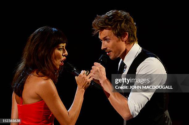 German act Marjan & Lukas perform during the Golden Hen media prize awards ceremony on September 19, 2012 in Berlin. AFP PHOTO POOL / JOHN MACDOUGALL