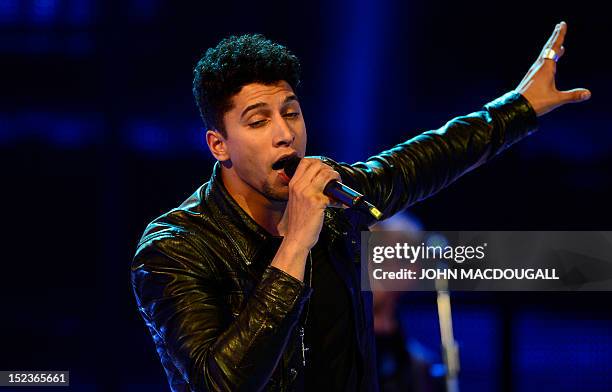 German singer Andreas Bourani performs during the Golden Hen media prize awards ceremony on September 19, 2012 in Berlin. AFP PHOTO POOL / JOHN...