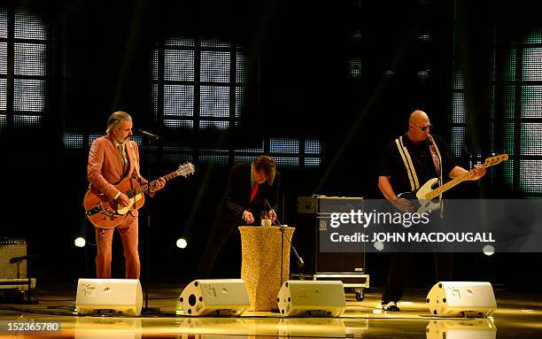 Belgian band Triggerfinger perform during the Golden Hen media prize awards ceremony on September 19, 2012 in Berlin. AFP PHOTO POOL / JOHN MACDOUGALL