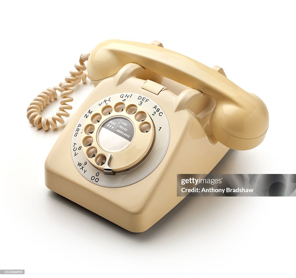 Retro style cream coloured telephone