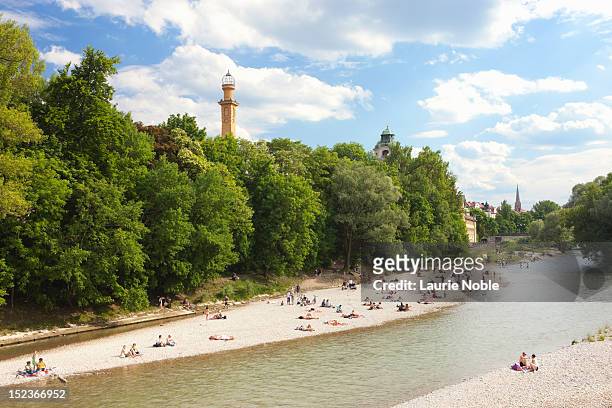 people sunbathing on the banks of the isar - isar münchen stock pictures, royalty-free photos & images