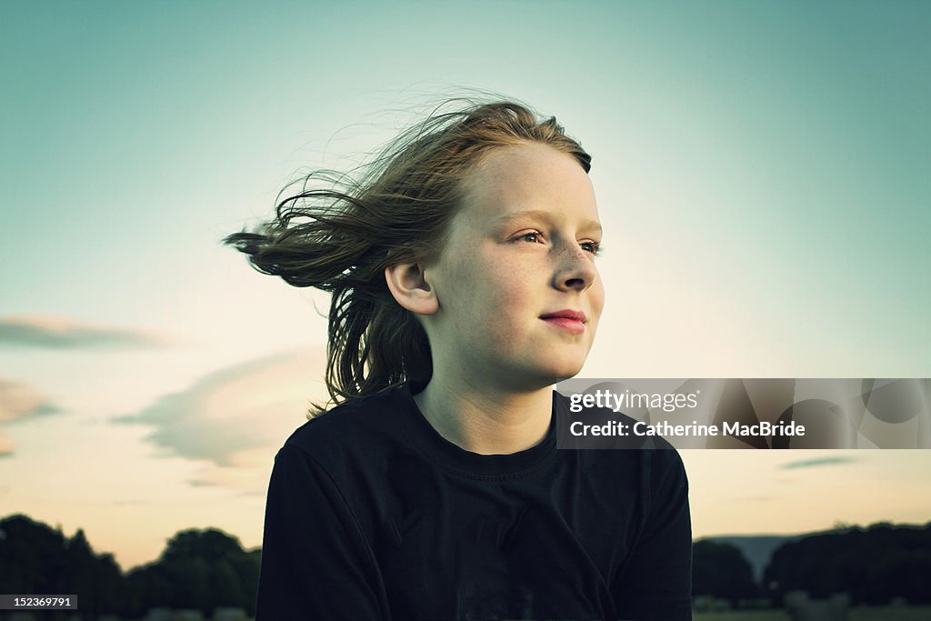 Boy with wind in his air