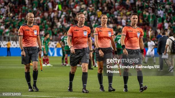 Officials Micheal Barwegen, Drew Fischer, Kathryn Nesbitt, and Joseph Dickerson leave the field after a game between Qatar and Mexico during the...