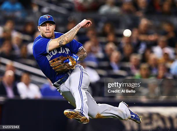 Brett Lawrie of the Toronto Blue Jays throws out Casey McGehee of the New York Yankees in the sixth inning during their game on September 19, 2012 at...