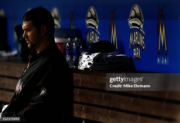 Josh Johnson of the Miami Marlins waits in the dugout during a game against the Atlanta Braves at Marlins Park on September 19, 2012 in Miami,...