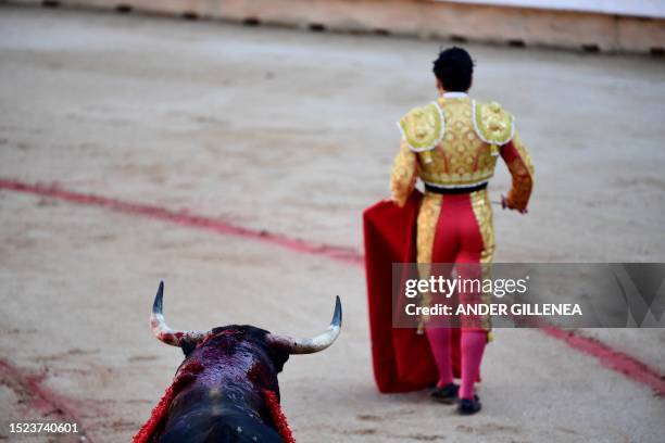 Spanish bullfighter Morante de la Puebla walks after performing a pass to a bull with a muleta during a bullfight of the San Fermin festival in...