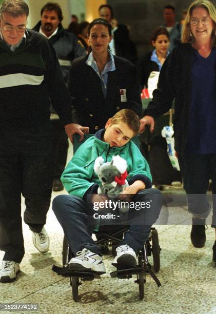 Sebastian Selo arrives in Melbourne with his parents Louis and Anna , 06 June 2001, from England on a Quantas mercy flight after other airlines...